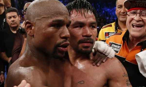 Two legends embrace