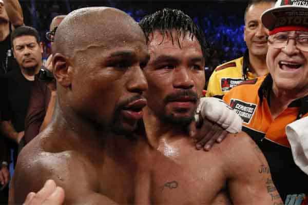 Two legends embrace